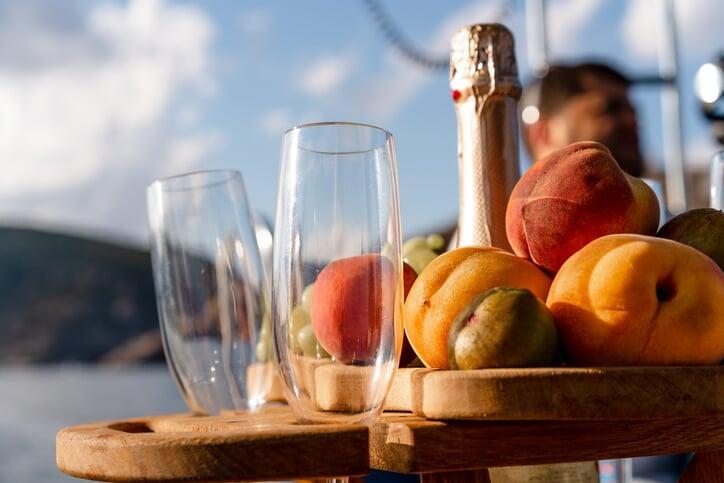 food and champagne with champagne flutes on a miami dinner cruise